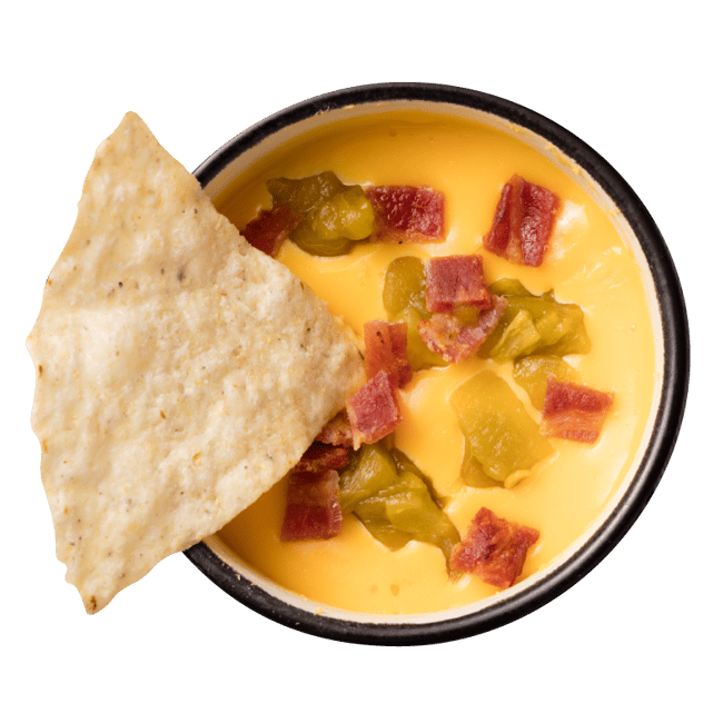 tortilla-chip-on-bowl-of-creamy-queso-1